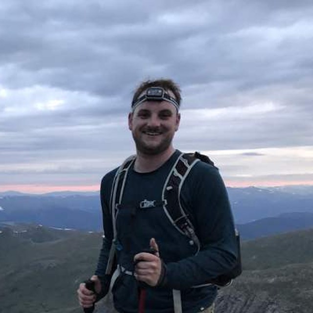 Chris on a summit at dusk